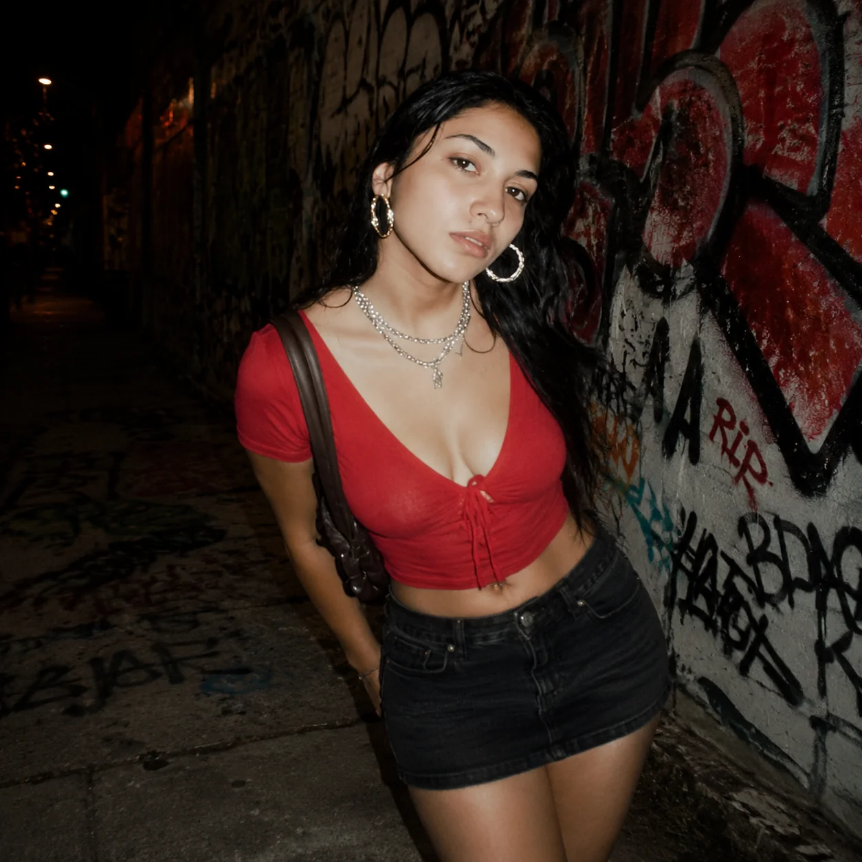 Adult woman photographed with direct flash at night